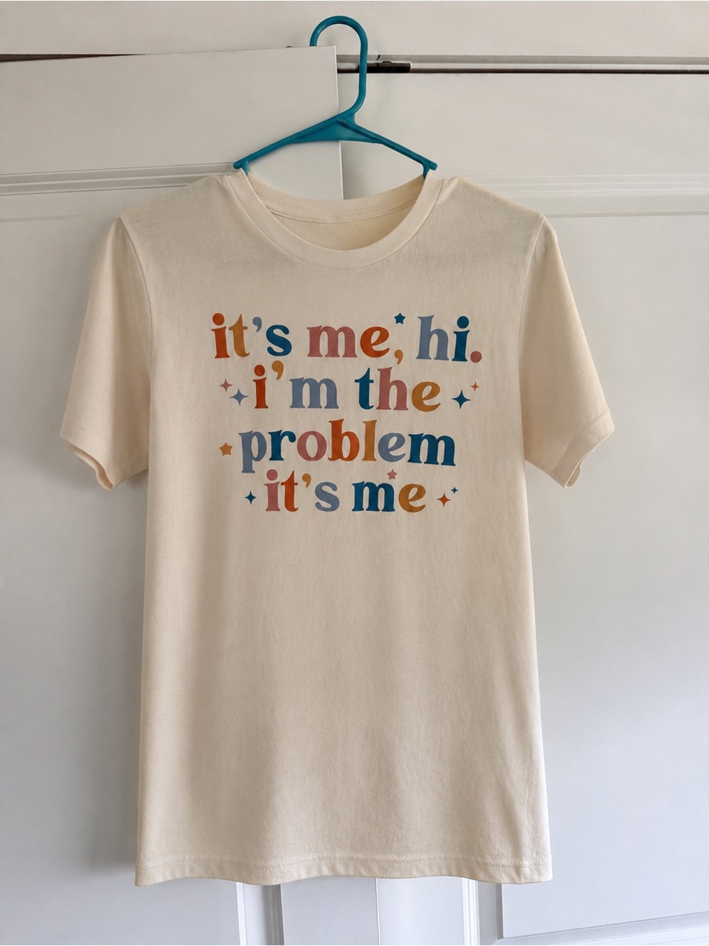 Taylor Swift Cream Graphic Tee with Retro Multicolor Text